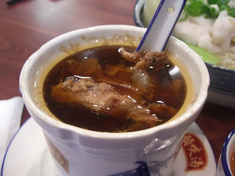 Double-boiled ginseng chicken soup in a lidded cup