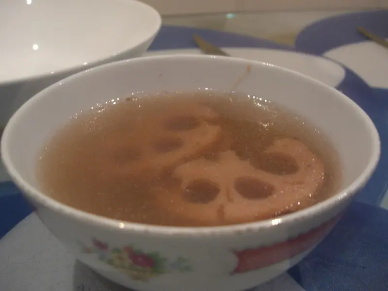 Lotus root slices in a clear pork soup