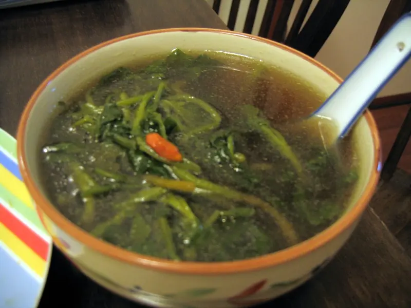 A bowl of Chinese watercress soup with pork and goji